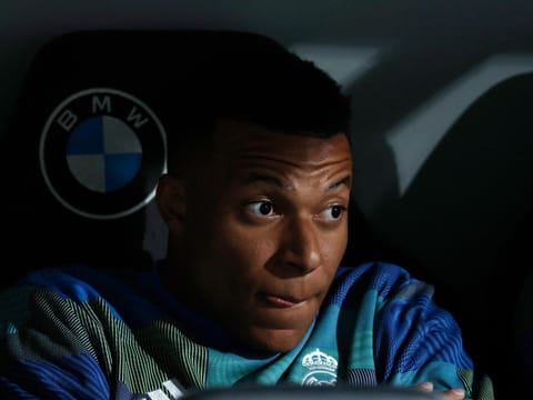 Real Madrid's French forward #10 Kylian Mbappe is pictured in the bench before the Spanish league football match between Real Madrid CF and Real Oviedo at Santiago Bernabeu Stadium in Madrid on May 14, 2026.