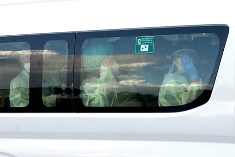 A bus carrying passengers caught up in the MV Hondius hantavirus outbreak, arrives at a purpose-built quarantine facility located on the outskirts of the Western Australian city of Perth on May 15, 2026.