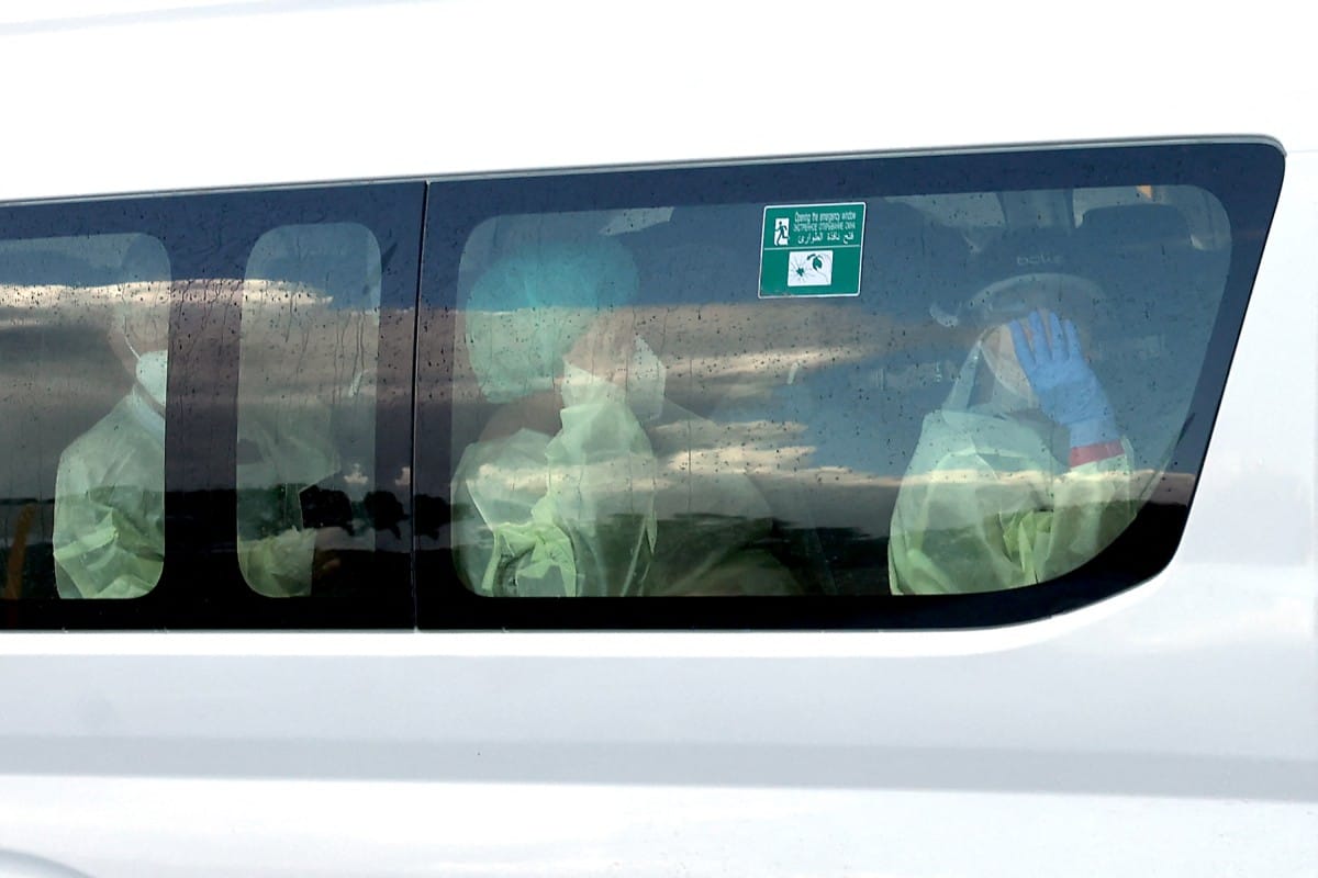 A bus carrying passengers caught up in the MV Hondius hantavirus outbreak, arrives at a purpose-built quarantine facility located on the outskirts of the Western Australian city of Perth on May 15, 2026.