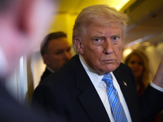 President Donald Trump speaks to reporters aboard Air Force One, Friday, May 15, 2026, as he returns from a trip to Beijing, China. 