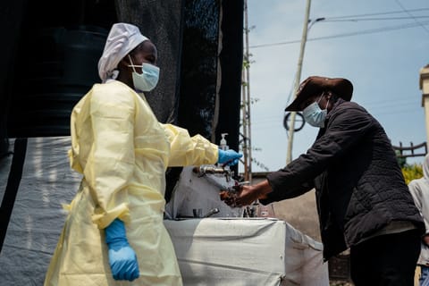 A visitor washes his hands before entering Kyeshero Hospital at a checkpoint for hand washing and temperature screening for all visitors and patients entering Kyeshero Hospital, as part of Ebola prevention measures in Goma on May 18, 2026.
