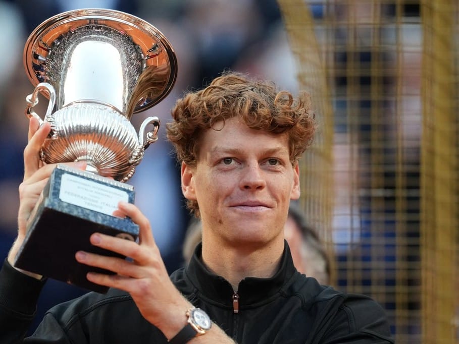 Jannik Sinner, of Italy, holds his trophy after defeating Casper Ruud in the final match to win the Italian Open tennis tournament