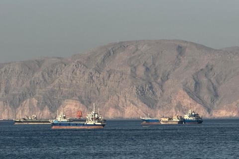 Vessels  anchored in the Strait of Hormuz, off the port city of Khasab on Oman’s northern Musandam Peninsula on May 17, 2026.