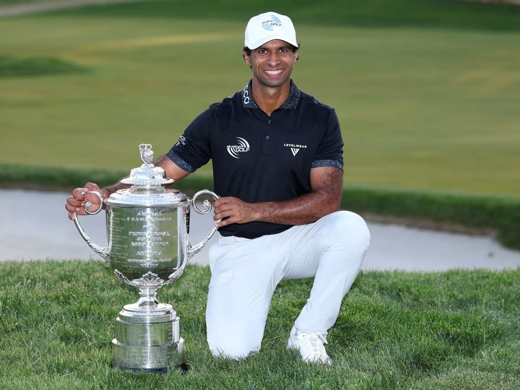 Aaron Rai of England celebrates with The Wanamaker Trophy after victo during the final round of the PGA Championship at Aronimink Golf Club