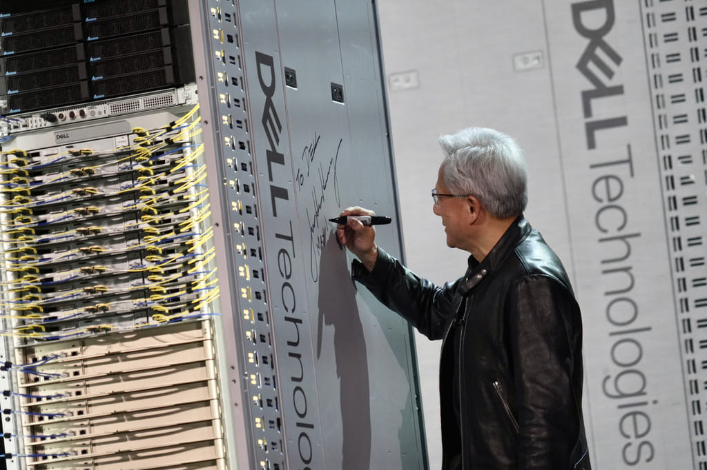 CEO of NVIDIA Jensen Huang signs a DELL machine at Dell Technologies World event happing in Las Vegas on Monday, May 18, 2026 (AP Phot/Ty ONeil)
