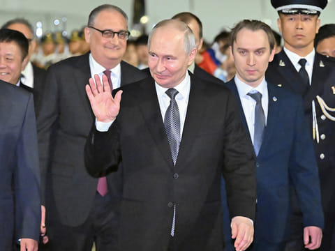 In this photo released by Xinhua News Agency, Russian President Vladimir Putin arrives for a state visit in Beijing.