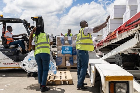 Ground crew load medical supplies onto a United Nations Humanitarian Air Service (UNHAS) operated charter plane bound for Bunia in eastern Democratic Republic of Congo as the World Health Organization (WHO) coordinates delivery as part of the response to an Ebola outbreak, at Jomo Kenyatta International Airport in Nairobi on May 20, 2026.