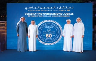 Rashed A. Al Ansari, Group CEO of Al Ansari Financial Services (extreme right); Mohammad A. Al Ansari, Chairman of Al Ansari Financial Services (inside right); Fuad A. Al Ansari, Board Member of Al Ansari Financial Services (inside left); and Eisa A. Al Ansari, Board Member of Al Ansari Financial Services (extreme left)