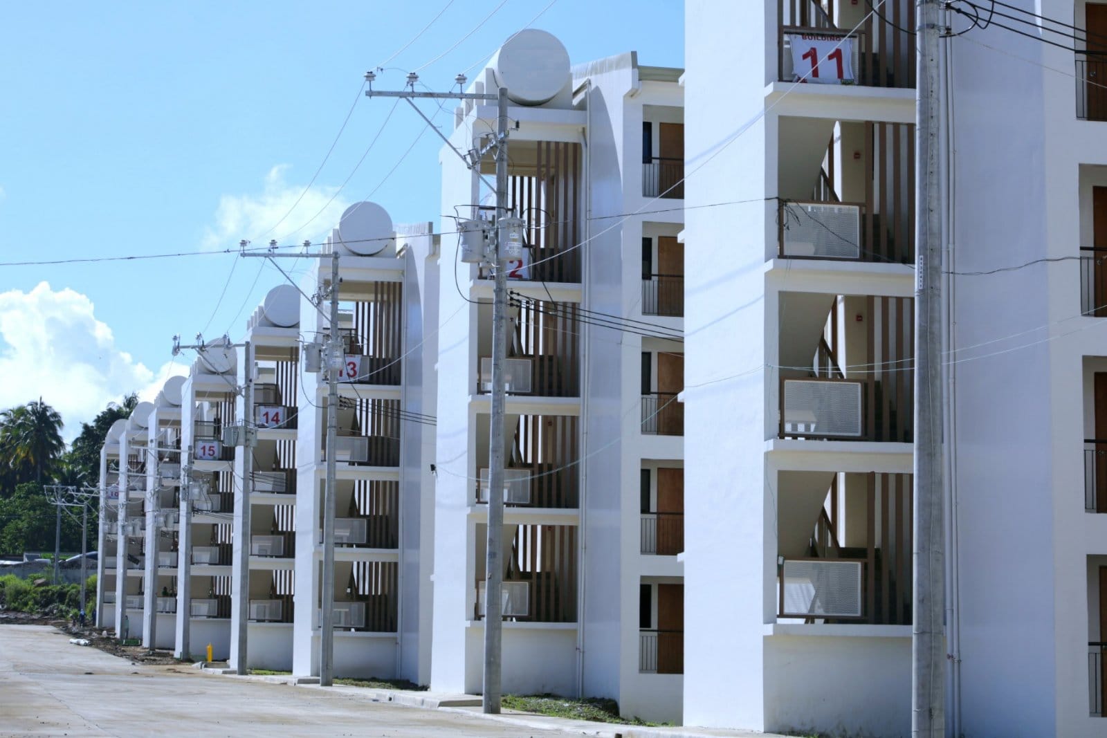 SOCIALISED CONDOMINIUM UNITS: Some of the 72 five-storey condominium buildings with a total of 7,200 housing units built in Calinan, Davao City. Located in People’s Ville, a 14.23-hectare property, the development also includes around two hectares of open spaces dedicated to parks, playgrounds, and community recreation areas for residents.