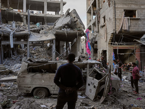 Palestinians inspect the rubble of the Ismail family home, destroyed in Israeli airstrike at Al Maghazi camp, in the central Gaza Strip.