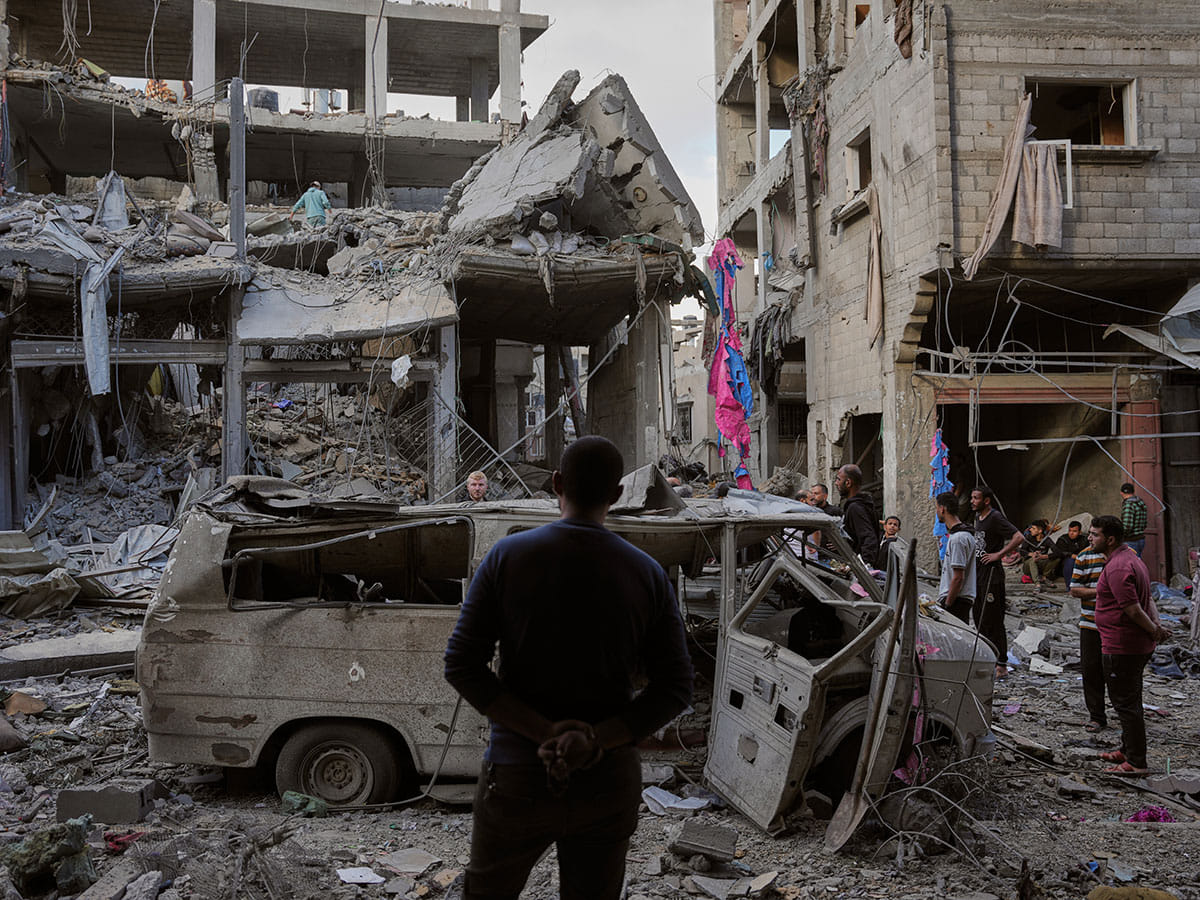 Palestinians inspect the rubble of the Ismail family home, destroyed in Israeli airstrike at Al Maghazi camp, in the central Gaza Strip.