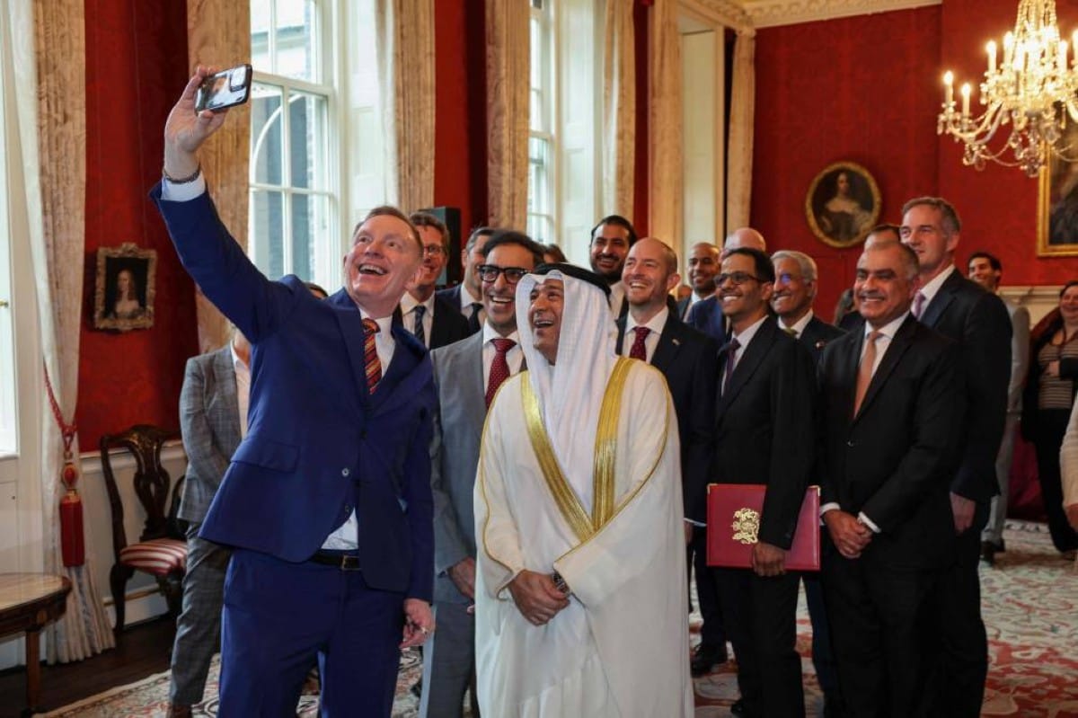 Britain Minister of State for Trade Chris Bryant, left, takes a group photo with Jasem Mohamed Albudaiwi, secretary general of the Gulf Cooperation Council, and delegation members during a signing ceremony at Downing Street in London, Wednesday, May 20, 2026.