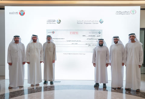 Officials from Rental Disputes Center and Dar Al Ber Society during the donation ceremony in Dubai