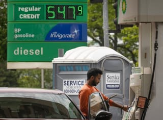 A customer fills up his car at a BP fuel station. File photo taken on May 21, 2026 in Skokie, Illinois.  