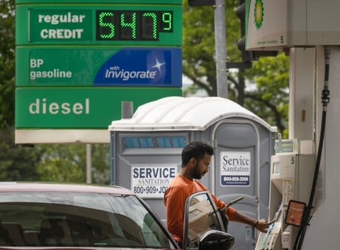 A customer fills up his car at a BP fuel station. File photo taken on May 21, 2026 in Skokie, Illinois.  