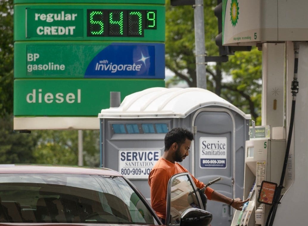 A customer fills up his car at a BP fuel station. File photo taken on May 21, 2026 in Skokie, Illinois.  