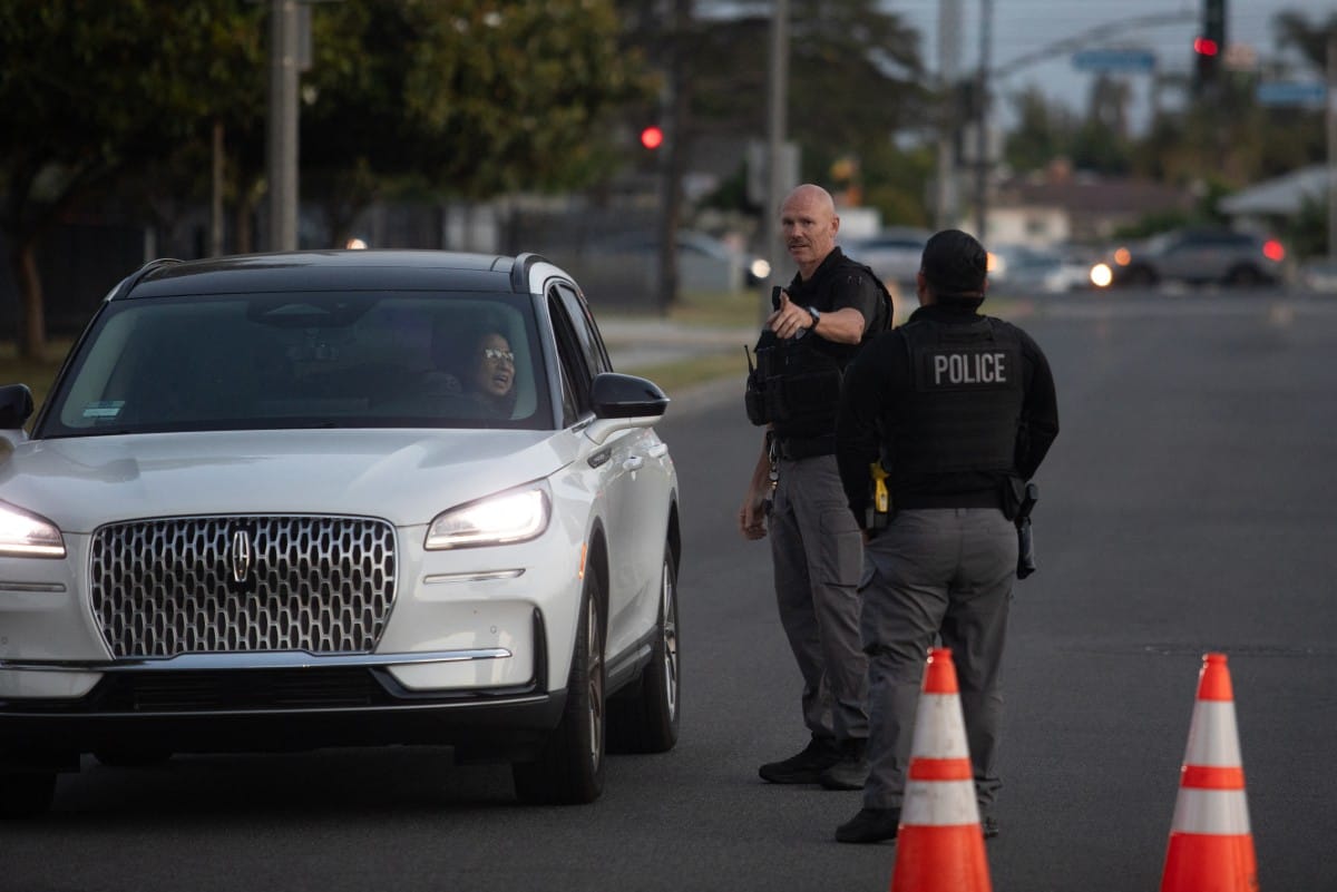 Garden Grove police direct evacuees towards a shelter after a chemical leak from a large storage tank threatened residents in Garden Grove, California on May 22, 2026.