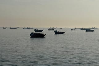 Vessels are seen anchored in the Strait of Hormuz, off the port city of Khasab on Oman’s northern Musandam Peninsula on May 17, 2026.