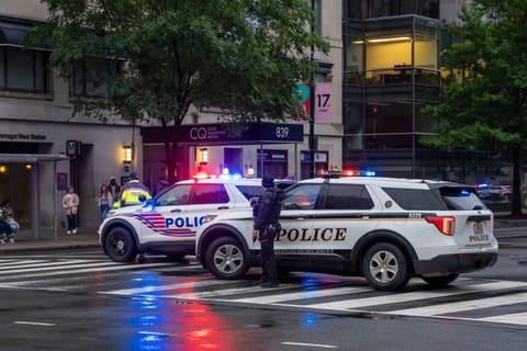 Emergency teams work the scene after multiple rapid-fire gunshots ring out near the White House on May 23, 2026 in Washington, DC. President Trump was reportedly inside the White House working on a peace deal with Iran.