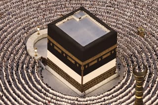 Muslims perform the evening prayer around the Kaaba, Islam's holiest shrine, at Grand Mosque complex on May 24, 2026, ahead of the annual Hajj pilgrimage.