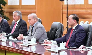 Field Marshal Asim Munir, Shehbaz Sharif and Ishaq Dar during a meeting during their trip to China