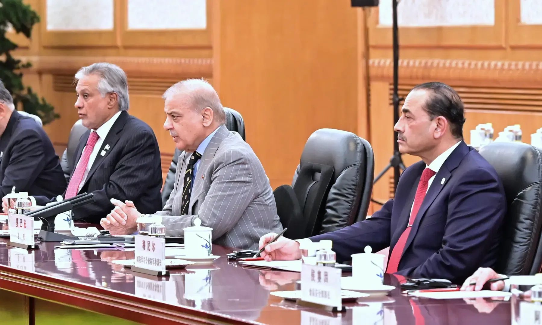 Field Marshal Asim Munir, Shehbaz Sharif and Ishaq Dar during a meeting during their trip to China