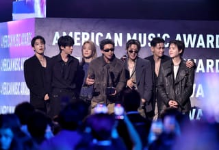 Jungkook, Jin, Jimin, RM, J-Hope, V and Suga of BTS accept the Artist of the Year award onstage during the 52nd American Music Awards at MGM Grand Garden Arena on May 25, 2026 in Las Vegas, Nevada.