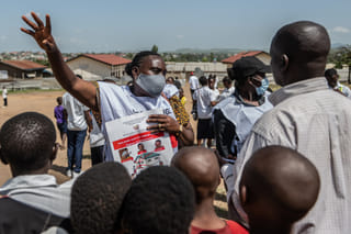Vanny Birungi, a Red Cross volunteer, speaks to people during a public sensitisation campaign amid the Ebola outbreak in Bunia, Congo, Monday, May 25, 2026. 