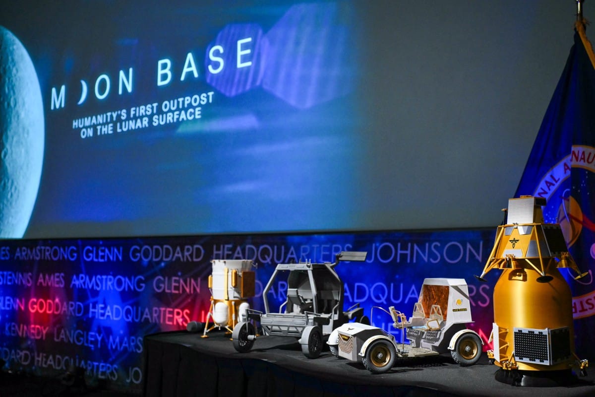 Models of lunar rovers and landers are displayed during a news conference at NASA headquarters in Washington, DC, on May 26, 2026, to outline plans for NASA's "Moon Base" lunar base and progress toward a sustained human presence on the Moon.