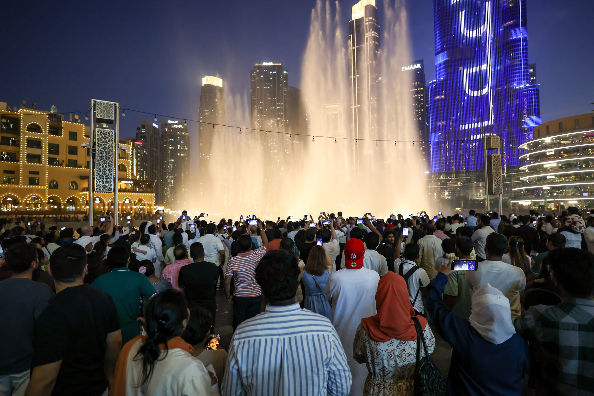 Huge crowd during Eid Al Adha celebrations at Dubai mall fountain area. 
