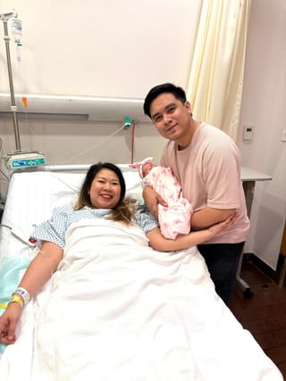 Filipino parents Almira Lat Trinidad and Joshua Trinidad with their baby girl Kaira