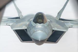 An F-22 Raptor during an aerial refueling: The US Central Command said that its aircraft carried out "defensive strikes" in southern Iran against targets including ​boats attempting ​to lay mines and ⁠missile launch sites. Attacks took place around Bandar Abbas and Larak Island in the Strait of Hormuz.