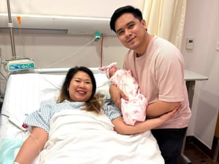 Filipino parents Almira Lat Trinidad and Joshua Trinidad with their baby girl Kaira