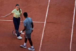 Brazilian chair umpire Ana Carvalho speaks to France's Moise Kouame as he plays against Paraguay's Adolfo Daniel Vallejo during their men's singles match on day 5 of the French Open tennis tournament on Court Suzanne-Lenglen at the Roland-Garros Complex in Paris on May 28, 2026.