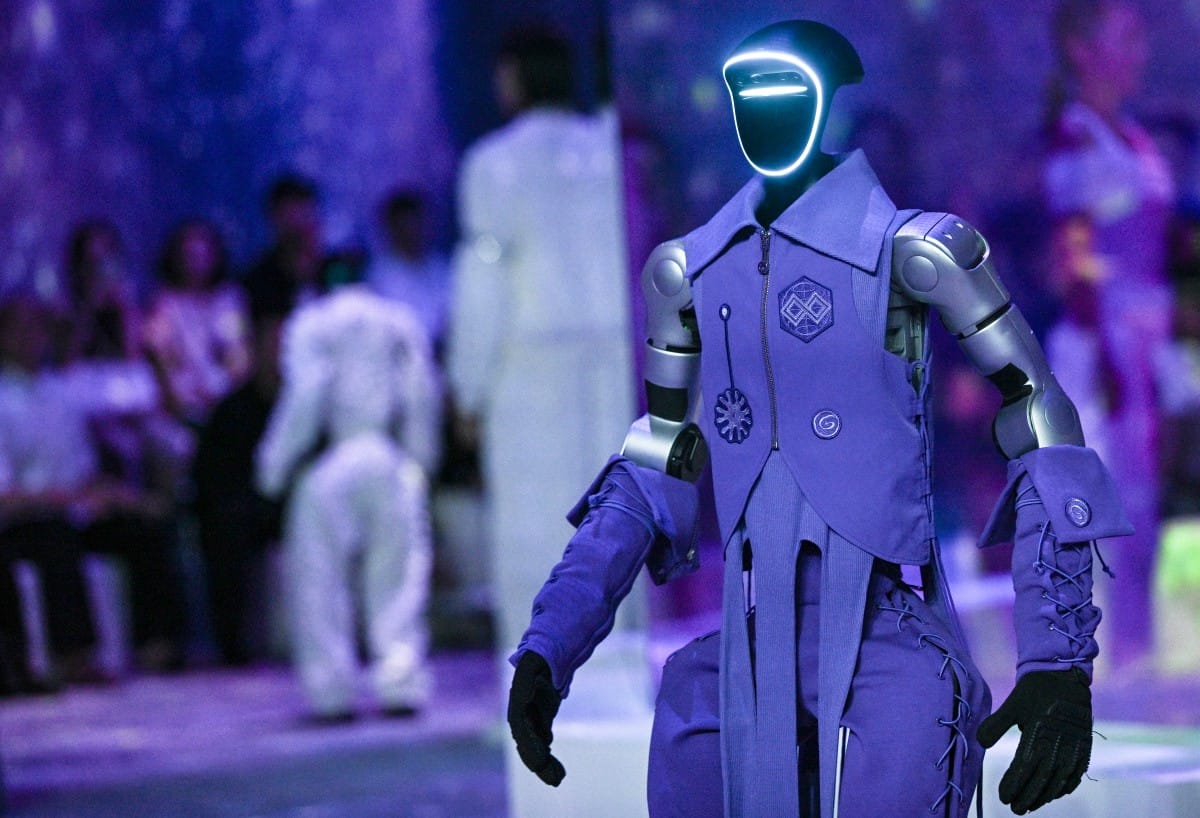 A humanoid robot presents creations at Galaxy Corporation's "Mach33: Physical AI Fashion Show" in Seoul.