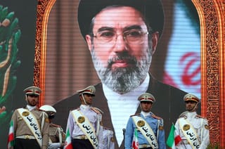 Iranian army soldiers stand in front of a picture of Iran's Supreme Leader Ayatollah Mojataba Khamenei, during a rally to show their solidarity and support in Tehran. File photo taken on April 29, 2026. 
