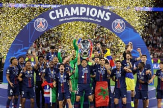 Paris Saint-Germain's Brazilian defender #05 Marquinhos lifts the trophy after winning the UEFA Champions League final football match between Paris Saint-Germain (PSG) and Arsenal FC at the Puskas Arena in Budapest on May 30, 2026.