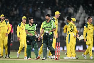 Pakistan's Abdul Samad (C-R), teammate Arafat Minhas (C-L) and Australia's players leave the field at the end of the first one-day international (ODI) cricket match between Pakistan and Australia at the Rawalpindi Cricket Stadium in Rawalpindi on May 30, 2026.