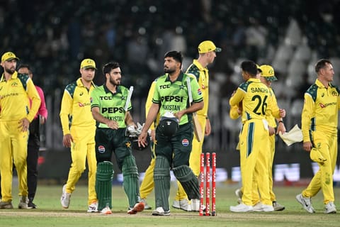 Pakistan's Abdul Samad (C-R), teammate Arafat Minhas (C-L) and Australia's players leave the field at the end of the first one-day international (ODI) cricket match between Pakistan and Australia at the Rawalpindi Cricket Stadium in Rawalpindi on May 30, 2026.