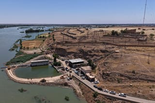 This aerial photograph shows flood waters along the water stations in Syria's Deir Ezzor province on May 31, 2026, following recent flooding as water levels from the Euphrates river rise.
