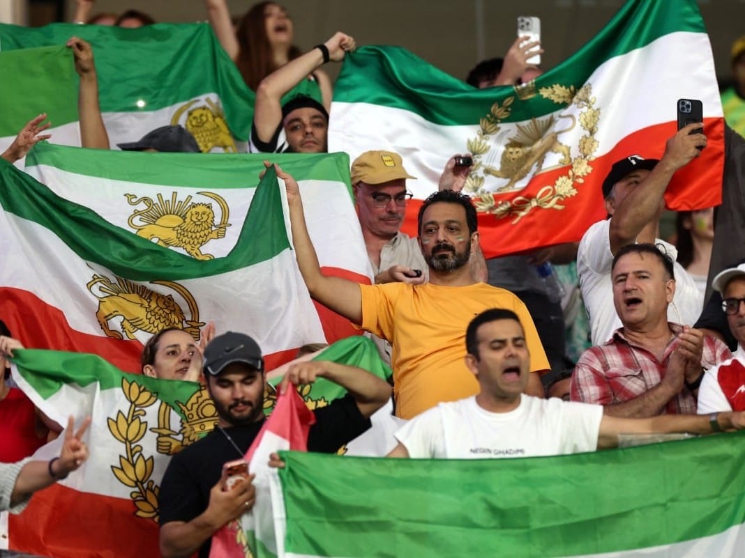 Iranian fans wave Pahlavi-era flags during the AFC Women’s Asian Cup Australia 2026 match between Iran and Australia in Gold Coast