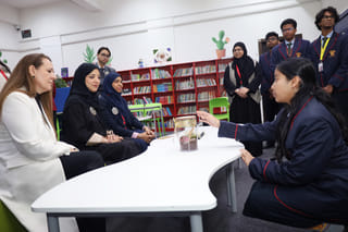 Aisha Sultan Majid Al Shamsi, Executive Director of the Ajman Office of Private Education Affairs, interacting with students 
