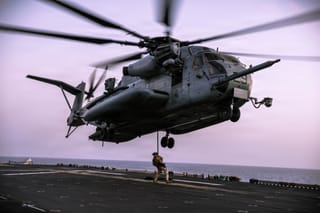 US Marines assigned to Maritime Raid Force, 31st Marine Expeditionary Unit, conduct fast rope training aboard USS Tripoli (LHA 7) in the Arabian Sea.