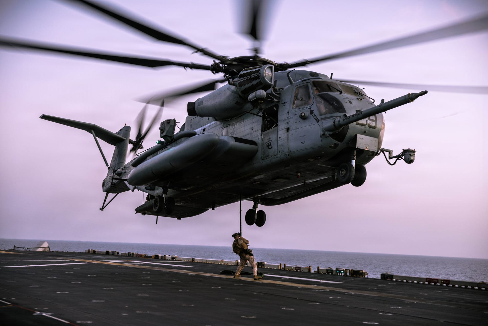 US Marines assigned to Maritime Raid Force, 31st Marine Expeditionary Unit, conduct fast rope training aboard USS Tripoli (LHA 7) in the Arabian Sea.