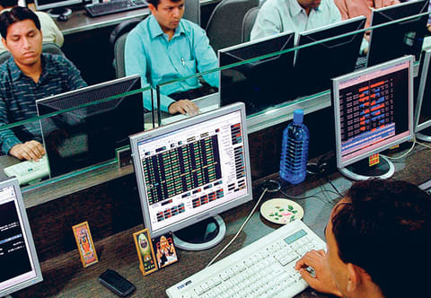Brokers busy at a firm in Mumbai. Amid raging doubts on how soon India’s economy would stage a comeback, the news of vaccines and hints of slightly better economic data were improving an earlier grim outlook for the country, while markets were seen sustaining its current rebound.
