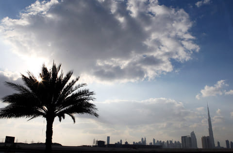 The Dubai skyline on a cloudy day.