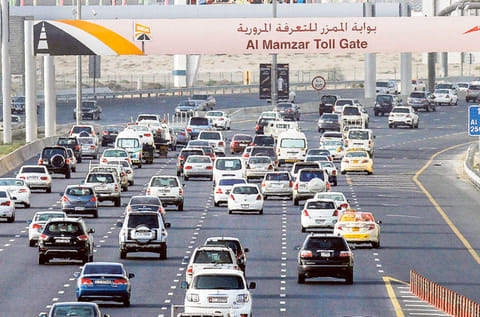 Motorists heading towards Sharjah on Al Ittihad road pass through a Salik gate.
