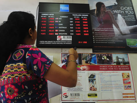 A currency exchange in Mumbai. Indian rupee strengthened 43 paise to end at 73.39  against the US dollar on Friday supported by persistent foreign fund inflows and weak American currency.