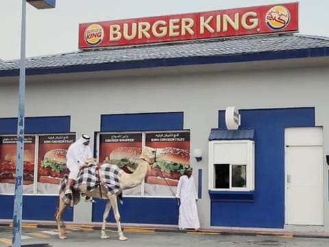 Hungry man visits Qatar Burger King drive-through on camel