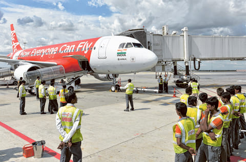 An AirAsia India Airbus A320 at Bengaluru. AirAsia Group Bhd.is  is selling its 32.7 per cent stake in AirAsia India Ltd. to its partner Tata Sons Ltd.